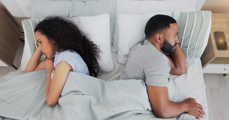 couple-fighting-silent-treatment-bedroom-103497916